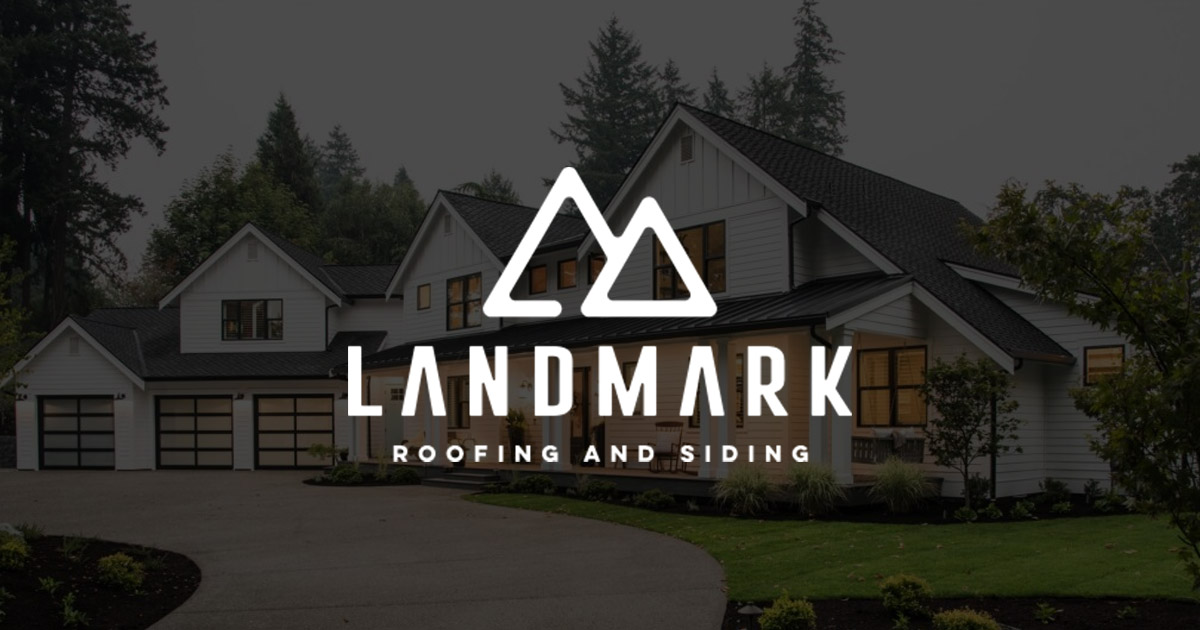 Front view of a large white house with multiple gabled roofs, surrounded by lush trees. The foreground features a driveway and garden. Overlaid is the Landmark Roofing and Siding logo with a stylized mountain design.
