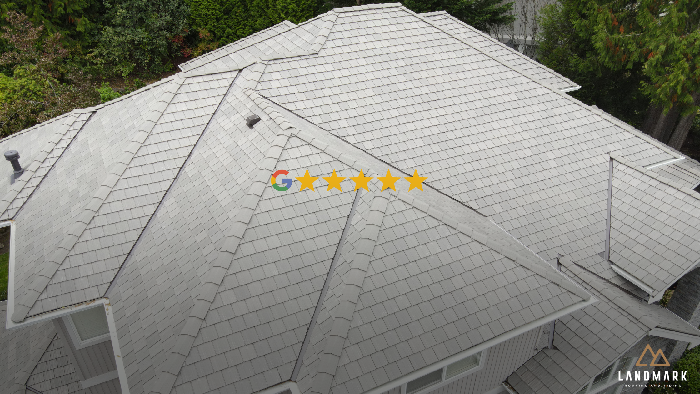 Aerial view of a finished Landmark Roofing & Siding project in Redmond, WA, showing a 5-star Google-rated composite roof installation.