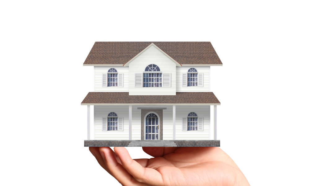 Hand holding a house symbolizing Landmark Roofing & Siding’s lifetime craftsmanship warranty in Redmond WA