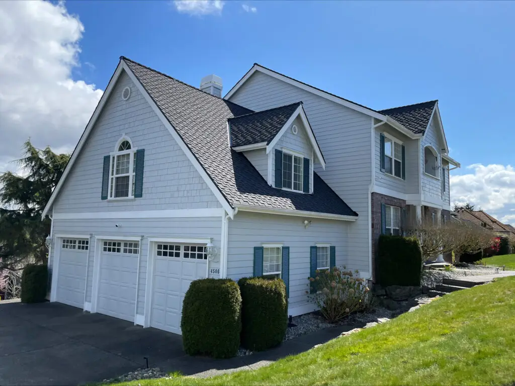 Roof replacement by Landmark Roofing & Siding in Tacoma, WA using CertainTeed Presidential TL in charcoal black.