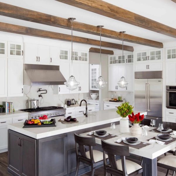 Interior cabinet painting with exposed wood beam staining in a custom kitchen in the Puget Sound area