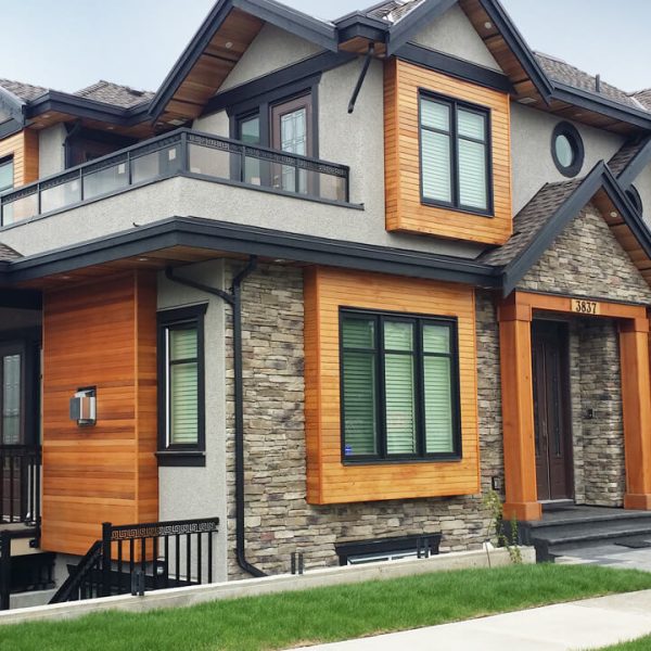 Exterior house painting with stained cedar trim and modern siding in Redmond, WA