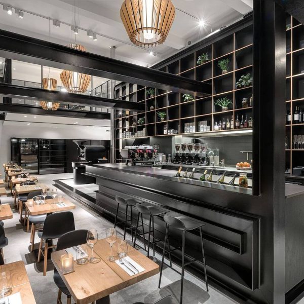Commercial interior painting with dark finishes for millwork and exposed beams in a modern restaurant space